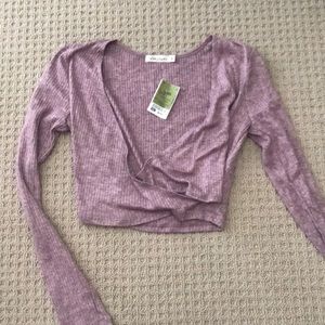 Brand new blush colored plunge neck crop top!